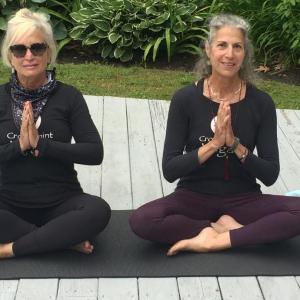 Crow Point Yoga instructors Sharon Goldhirsch, left, and Wendy Johnson strike a pose during a morning class being held outside six days per week at Spruce Point Inn. BILL PEARSON/Boothbay Register