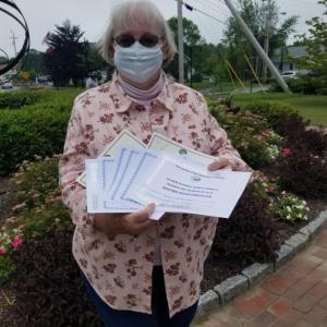 BRGC President Linda Bonin proudly showing awards presented to the club by the GCFM and National Garden Clubs for 2019. Courtesy photo