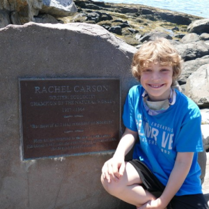 Quillan Morrison, 8 year-old-son of David and Trina Morrison, summer residents on McKown Point, at the Rachel Carson memorial. Courtesy of Marion Coleman