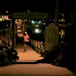Tom Cotter about to cross the finish line. Bob Crink photo