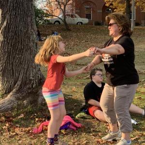 Lotus LaFrance, 8, of Edgecomb dances with mother JoEllen Saturday afternoon on Wiscasset common to the music of Salty Dogs on Scarecrowfest’s opening day. SUSAN JOHNS/Wiscasset Newspaper