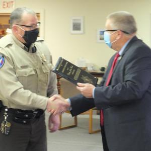 Lincoln County Sheriff Todd Brackett, right, congratulates Deputy James Read Nov. 16 for receiving the Maine Sheriff Association’s Community Service Award. BILL PEARSON/Boothbay Register