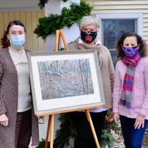 Receiving the donation for The Lincoln Home by Ann Poole
are Drucilla Day Beal, Director of Nursing and granddaughter of artist Jake Day; and Lorrie Winslow, executive director. Courtesy of Kim Traina