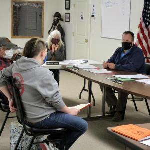 The Woolwich selectboard reviews the application of Fred King and Sayra Small, owners of Farley’s Cannabis Farm. PHIL DI VECE/Wiscasset Newspaper