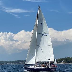 Caliente crossing the finish line of the Commodore's Cup race. Courtesy of Jon Dunsford