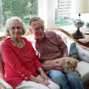 Jacquie and Warren Price at home with their friend, Marsea. JANE CARPENTER/Boothbay Register