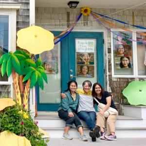 FTD’S Porch Parade on Commercial Street, Boothbay Harbor. Patty Zinkowski with Thai Daughters, Pink Ayi, left, and Dao Mayer. Courtesy photo
