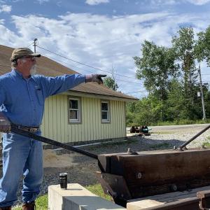 Museum President David Buczkowski discusses how trains will enter the engine house’s bays. SUSAN JOHNS/Wiscasset Newspaper