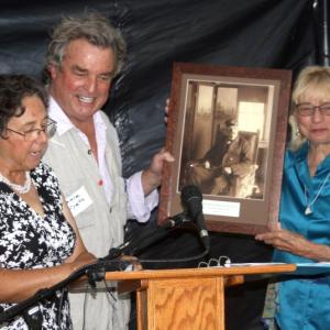 Elaine Jones and Gov. Janet Mills present artist Jamie Wyeth with a Lighthouse Preservation Award. STEVE EDWARDS/Boothbay Register