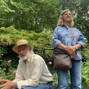 Steve and Carolyn Fife take in music in the Sunken Garden Aug. 18, the start of Schoonerfest in Wiscasset. SUSAN JOHNS/Wiscasset Newspaper