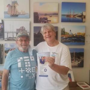 Ed Brown hands a $250 check to Boothbay Region Health Center board member John Webster. Courtesy photo