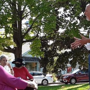 Noted mystery author Bruce Robert Coffin speaks to guests on the Boothbay Harbor Memorial Library lawn Saturday, Sept. 18. JANE CARPENTER/Boothbay Register