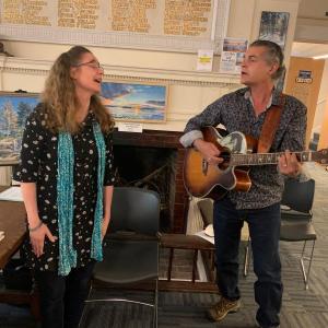 Author Lara Tupper and her husband Bobby Sweet sing Sept. 9 during her discussion at Boothbay Harbor Memorial Library. BILL PEARSON/Boothbay Register