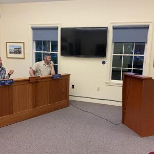 Local businessman Lester Spear, right, listens to Boothbay selectmen’s recommendation Sept. 8 to move his Trucks A-Go event to Boothbay Common. BILL PEARSON/Boothbay Register