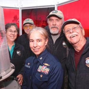 In the lantern room of Burnt island Lighthouse on the 200th anniversary, keepers Elaine Jones, Henry Sieg; Paul Kelly and Randy Griffing with USCG Capt. Amy Florentino. Robert Mitchell photo