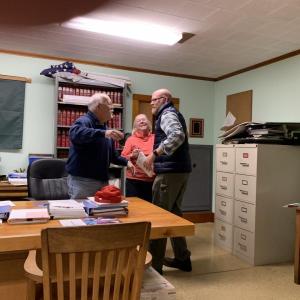 Southport Selectman Smith Climo gives newly appointed facilities director and public works director Adam Harkins a hug Nov. 10, after Selectman Mary Lou Koskela gave him one. BILL PEARSON/Boothbay Register