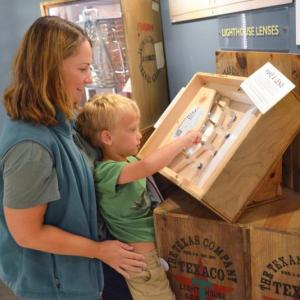 A young museum visitor explores the Maine Maritime Museum exhibits. Courtesy of Maine Maritime Museum