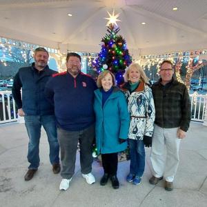 Boothbay Civic Association honors Estelle Appel Dec. 9 with a Christmas tree in her memory. From left are Town Manager Dan Bryer, Selectman Chuck Cunningham, BCA member Dawn Gilbert, Appel’s daughter Judy Appel White and BCA member Lincoln Erhard. Andrea Lowery photo