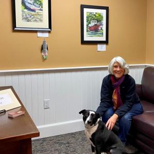 Maine artist Susan Tan’s paintings will be displayed at Atlantic Motor Car through March. Above, Susan and Bo. Courtesy photo