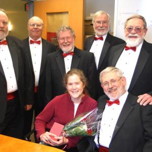 Nor’easters Barbershop Chorus members love delivering singing valentines that include a photo, rose and card. Courtesy photo