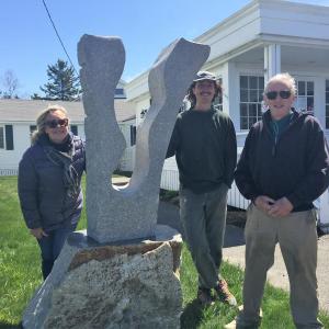 The recent addition to the Sculpture Boothbay trail, “Voyage” by Joseph DiMauro, center, was installed at Ocean Point Inn May 5. Also there were Sculpture Boothbay board members Patricia Royall and stone sculptor Bill Royall. LISA KRISTOFF/Boothbay Register