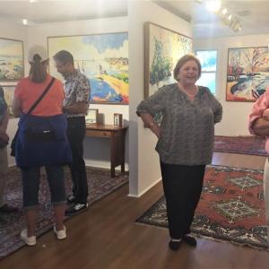 Gleason Fine Art saw a lot of action July 1 with two of its represented artists – Henry Isaacs (above, right) and Kevin Beers promoting their new shows. That’s Marty Gleason next to Isaacs. LISA KRISTOFF/Boothbay Register