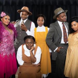 “The Color Purple” cast, from left: DeQuina Moore (Shug Avery), Kelvin Roston Jr. (Mister), Tavia Rivée (Nettie), Lawrence Flowers (Harpo), Dori Waymer (Squeak / Ensemble). Seated: Jaden Dominique (Celie). Jared Morneau Photography