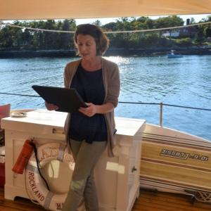 Jane Barnes, co-owner of schooner Ladona, reads the proclamation from Gov. Janet Mills during the vessel’s centennial celebration Sept. 8 at Hodgdon Marina. LISA KRISTOFF/Boothbay Register