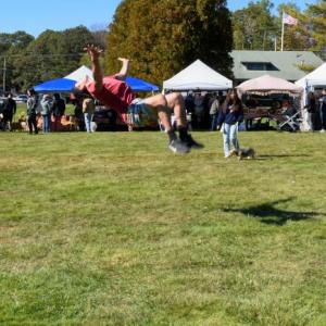 Fireman E3 Raymond Mellett stationed at the USCG in West Boothbay Harbor turned acrobat along with members of his family at the Fall Foilage Festival at Boothbay Railway Village Oct. 8. LISA KRISTOFF/Boothbay Register