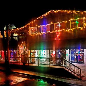 Downtown Boothbay Harbor businesses lit up for the holiday season. File photo