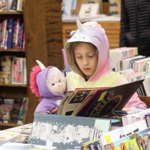 These two unicorns stopped to peruse one of the magic books at Sherman’s during Boothbay Harbor’s Early Bird Sale & Pajama Party. STEVE EDWARDS/Boothbay Register