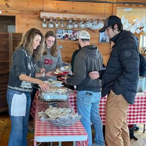 Boothbay Harbor road crew Jessie Peters and Jay Hasch grab a hot bite from Lori and Sara Mitchell. Jennie Mitchell photo