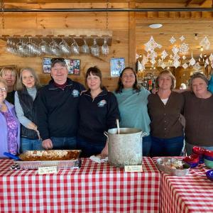 Russ and Cathy Pinkham, fourth and fifth from left, and some regular Community Lunch workers. Jennie Mitchell photo