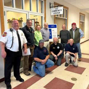 Meeting at the Community Center for support of its Emergency Sign Program are, from left, kneeling: Chief Nick Upham BHFD; Chief Doug Snyder BHPD; Officer Larry Brown BHPD; standing: Chief Dan Gardner BRAS; Chief Dick Spofford BFD; Supervisor Tara Dow Lincoln County Communications; Shawn Lewin board president; Community Center, Dwight Lewis, Emergency Sign maker; and Steve Gaudette SPD. Courtesy photo
