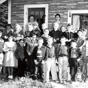 Postmaster Harriet Orchard and teacher Emolyn Smith Pratt, (back row) on a field trip with the 3rd, 4th, and 5th grade to the West Southport Post Office. Photo courtesy of the Hendricks Hill Museum.