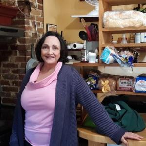 Lorie Demers in Mama D’s small kitchen which puts out 200 made to order meals each day the cafe is open. JANE CARPENTER/Boothbay Register