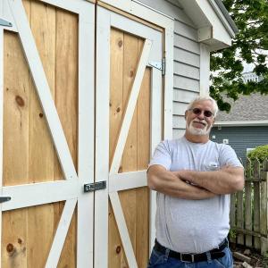 Ray Ricci and the new storage shed at the Boothbay Harbor Memorial Library. Courtesy of John Nunan