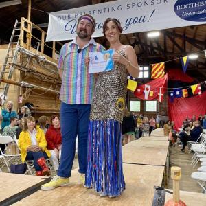 July Hasch, pictured with emcee Michael Maxim, wins both the Judge’s and People’s Choice award. ISABELLE CURTIS/Boothbay Register