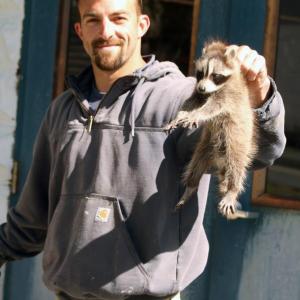 Bruce Orne with one of the two raccoons. STEVE EDWARDS/Boothbay Register