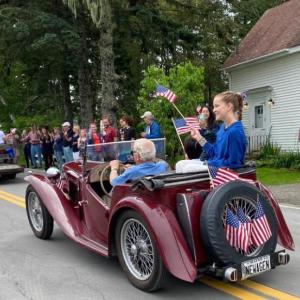 Ham Meserve in his MG and his grandkids roll past the onlookers at the Southport Island Association’s July 4 parade. Courtesy of Helen Meserve