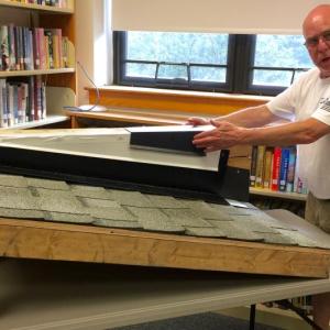 CSD Director of Facilities Dave Benner presents a model of roof parapet repairs proposed to mitigate water intrusion at BRES. FRITZ FREUDENBERGER/Boothbay Register