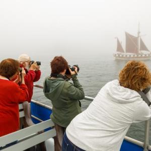 Photographers on the Windjammer Days Photography Cruise focus their lenses on the Virginia. Michael Leonard photo
