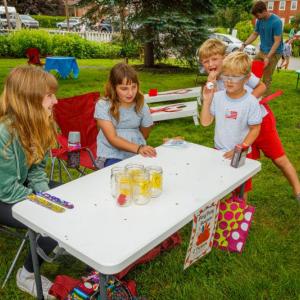 From left, Jessie Ullo, Kayla Watts and Grant Lovelace play a game at BHML’s fundraising carnival. Michael Leonard photo