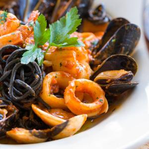 “Chitarrucci Neri Ai Fruitti Di Mare,” my favorite dish at Ports of Italy. Courtesy of restaurant website