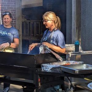 BRES Principal Shawna Kurr cooks on the grill. CANDI JONETH/Boothbay Register