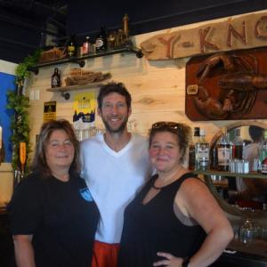 From left: Carol Heaberlin, Nick Heaberlin, and Mindy Jones stand behind the bar at their new restaurant, Y-Knot on the Water Gourmet Eatery, at 85 Parking Lot Lane in downtown Damariscotta. The location was previously the home of Maine Booch and Van Lloyd’s Bistro. Johnathan Riley photo
