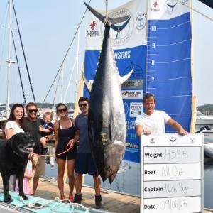 Nick Page, left of fish, celebrates his 438.5-pound weigh in. FRITZ FREUDENBERGER/Boothbay Register