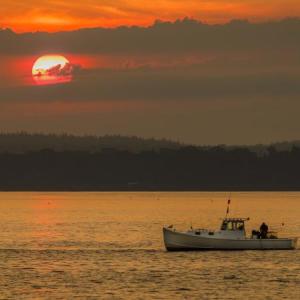 Lobster fishermen at work as the sun rises on Sept. 9. Mike Leonard photo