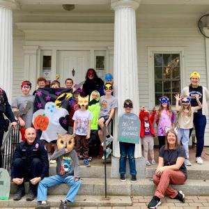 Sergeant Jacob Powers and Officer Larry Brown with a group of library kids and adults are looking forward to the Halloween Parade Oct. 31 in Boothbay Harbor. Courtesy of John Nunan