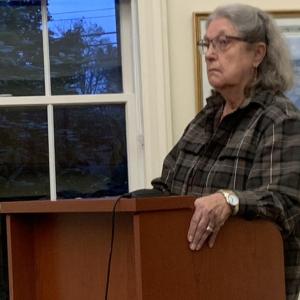 Boothbay resident Pam Reed urges selectmen Oct. 11 to find a cheaper solution to local education costs than the proposed $89 million school renovation plan on the November ballot. BILL PEARSON/Boothbay Register
